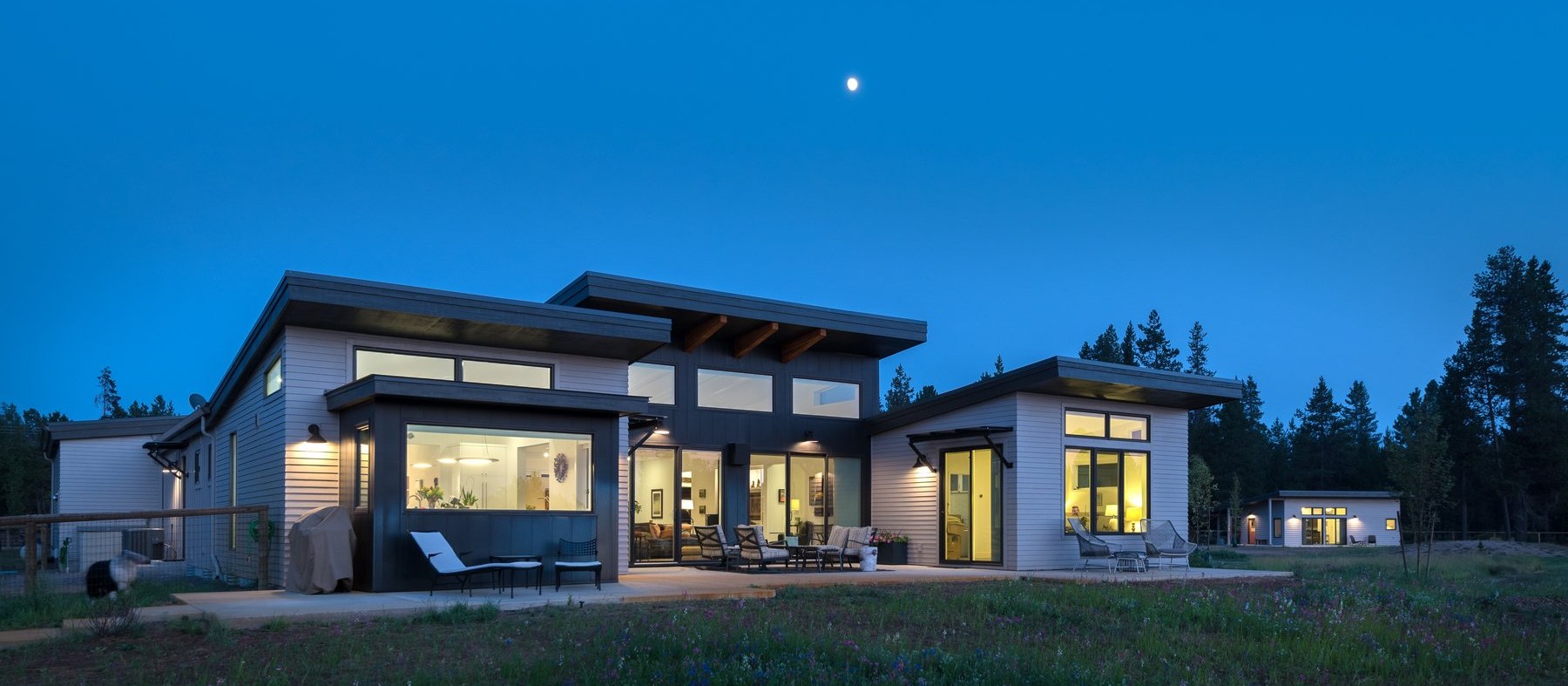 Modern Central Oregon home at twilight under the moon